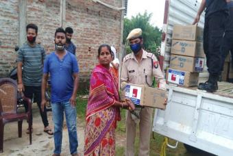 Handing over of essential grocery box