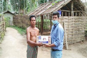 Handing over of essential grocery box